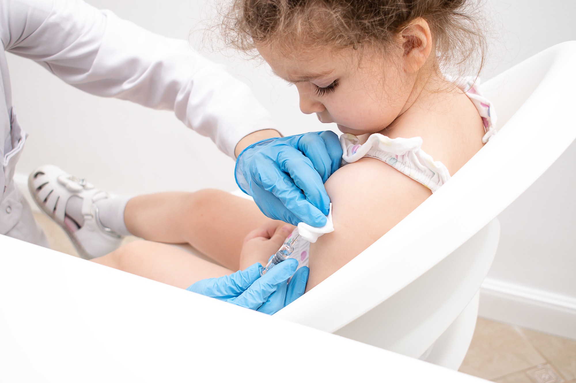 doctor vaccinates a girl.Medicine and healthcare concept.Vaccination against childhood diseases